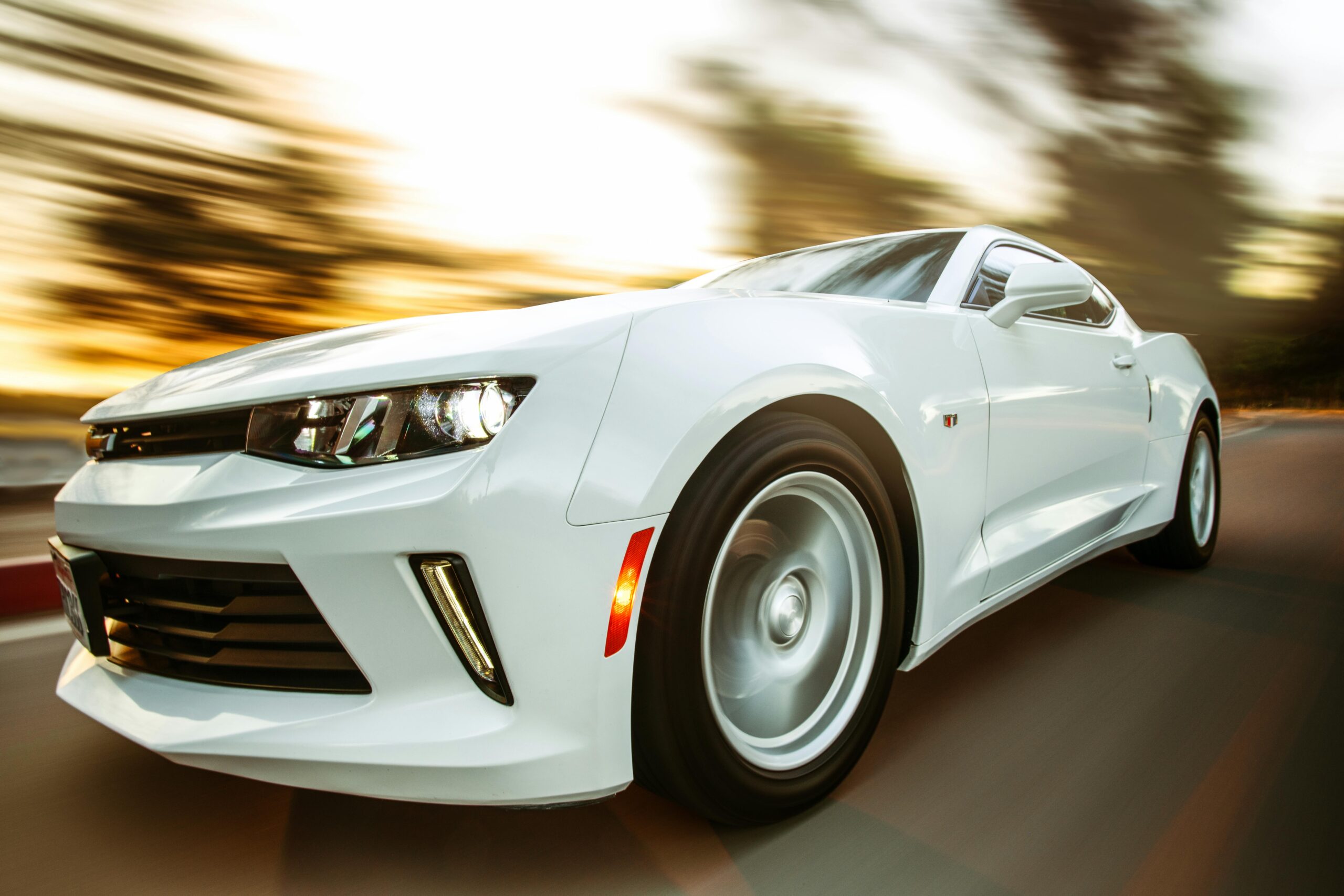 Photo by Jesse Zheng: https://www.pexels.com/photo/close-up-photography-of-white-chevrolet-camaro-1213294/